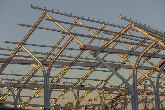 rows of steel beams forming a peaked roof